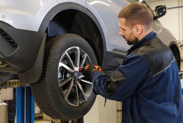 Auto Insurance and Roadside Assistance and What’s Included? - Car Disc Brake for Repair, in the Process of Replacing a New Tire